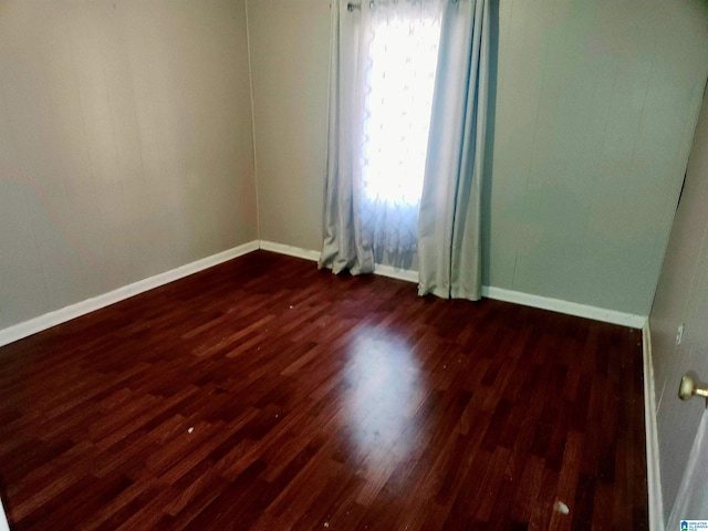 5810 Stemley Bridge Rd, Talladega, AL 35160 - empty room featuring dark wood finished floors and baseboards