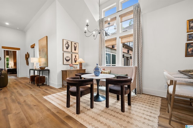 1761 Gable Way, Hoover, AL 35244 - dining area with high vaulted ceiling, wood finished floors, recessed lighting, baseboards, and a chandelier