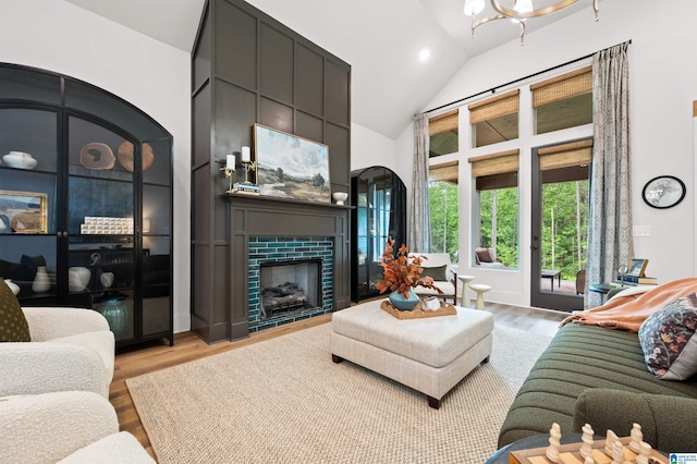 1761 Gable Way, Hoover, AL 35244 - living area with light wood-type flooring, high vaulted ceiling, a large fireplace, and recessed lighting