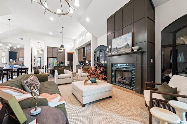 1761 Gable Way, Hoover, AL 35244 - living room featuring a chandelier, a towering ceiling, a tiled fireplace, and recessed lighting