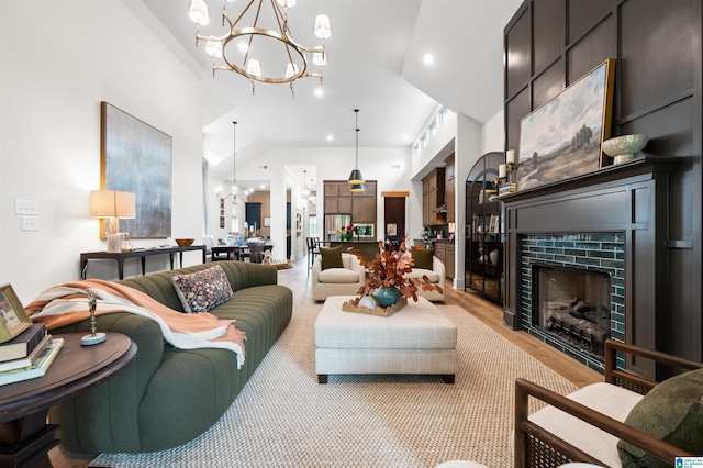 1761 Gable Way, Hoover, AL 35244 - living area with a chandelier, light wood-style floors, a fireplace, lofted ceiling, and recessed lighting