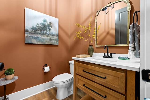 1761 Gable Way, Hoover, AL 35244 - bathroom with vanity, toilet, wood finished floors, and baseboards