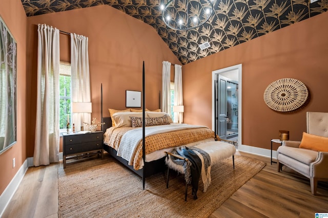 1761 Gable Way, Hoover, AL 35244 - bedroom with a chandelier, wood finished floors, baseboards, connected bathroom, and high vaulted ceiling