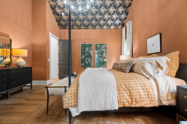 1761 Gable Way, Hoover, AL 35244 - bedroom with wood finished floors, a towering ceiling, and baseboards