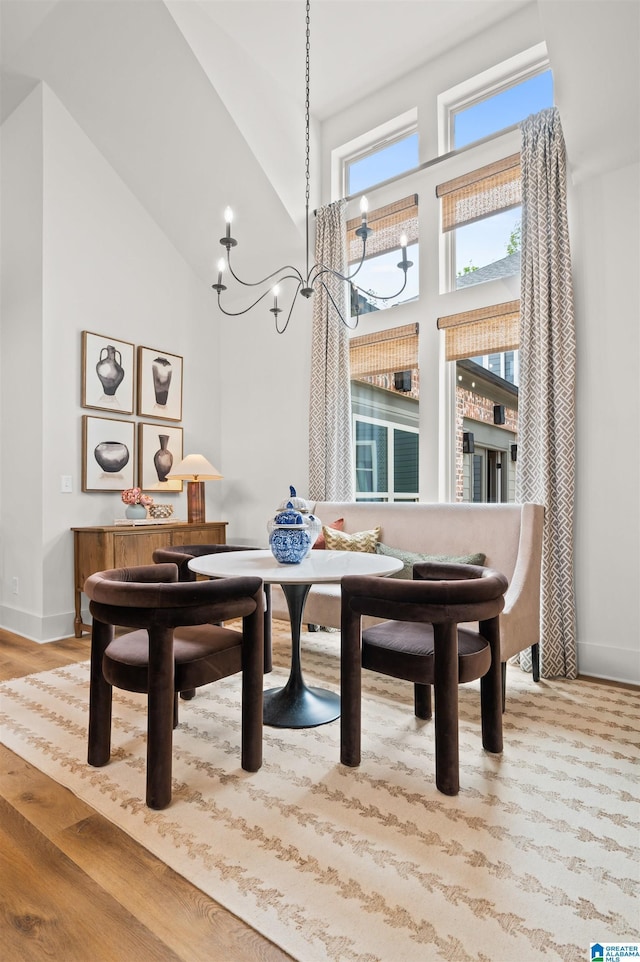 1761 Gable Way, Hoover, AL 35244 - dining space with high vaulted ceiling, a chandelier, wood finished floors, baseboards, and breakfast area