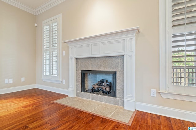 1343 Chapel St, Hoover, AL 35226 - detailed view of wood finished floors, ornamental molding, baseboards, and a tiled fireplace