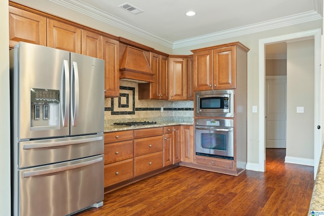 1343 Chapel St, Hoover, AL 35226 - kitchen with stainless steel appliances, custom exhaust hood, crown molding, backsplash, and light stone countertops