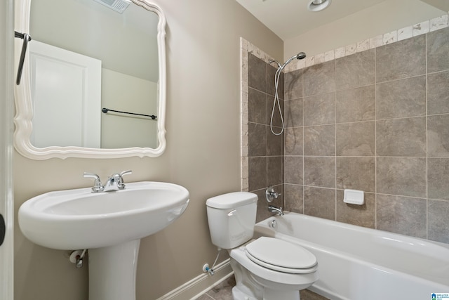 1343 Chapel St, Hoover, AL 35226 - bathroom featuring toilet, baseboards, tub / shower combination, and a sink