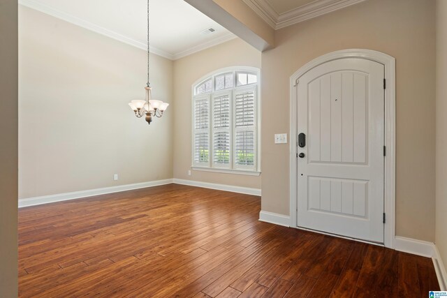 1343 Chapel St, Hoover, AL 35226 - entryway featuring a chandelier, dark wood-style flooring, ornamental molding, and baseboards