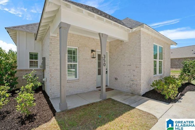 350 Shiloh Creek Dr, Calera, AL 35040 - view of exterior entry featuring brick siding and roof with shingles