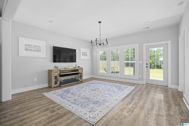 350 Shiloh Creek Dr, Calera, AL 35040 - living room with a chandelier, wood finished floors, and baseboards