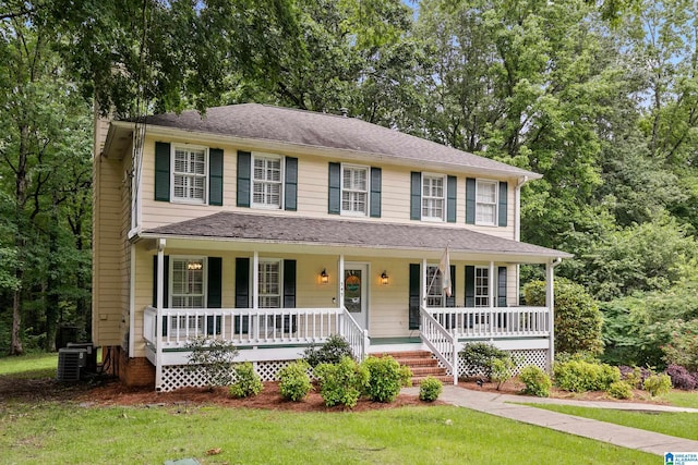 545 Russet Bend Dr, Hoover, AL 35244 - colonial house featuring covered porch, a front yard, central air condition unit, and view of scattered trees