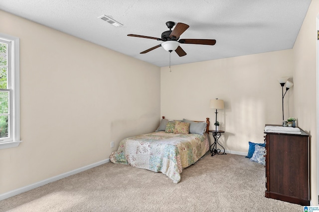 545 Russet Bend Dr, Hoover, AL 35244 - bedroom featuring light colored carpet, multiple windows, baseboards, and a ceiling fan
