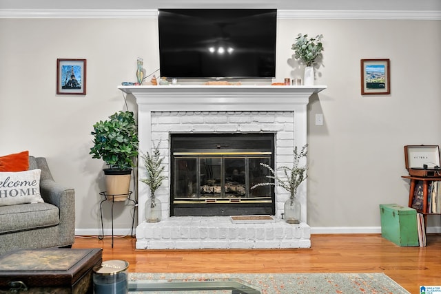 545 Russet Bend Dr, Hoover, AL 35244 - detailed view of crown molding, wood finished floors, baseboards, and a fireplace