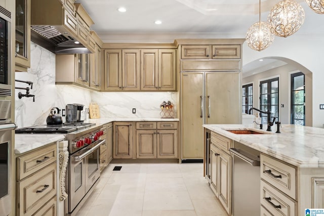 2821 Shook Hill Cir, Mountain Brook, AL 35223 - kitchen with high end appliances, arched walkways, a sink, crown molding, and custom range hood