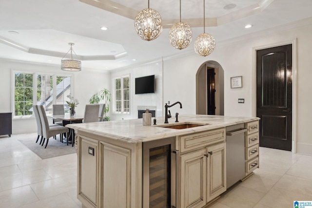 2821 Shook Hill Cir, Mountain Brook, AL 35223 - kitchen featuring beverage cooler, cream cabinets, a raised ceiling, arched walkways, and dishwasher