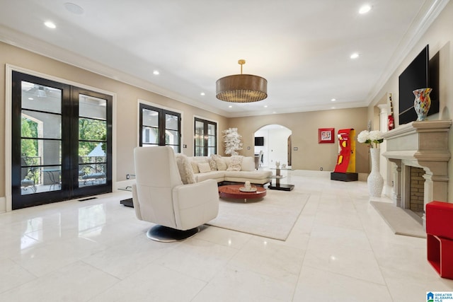 2821 Shook Hill Cir, Mountain Brook, AL 35223 - living area featuring arched walkways, recessed lighting, french doors, ornamental molding, and a fireplace with raised hearth