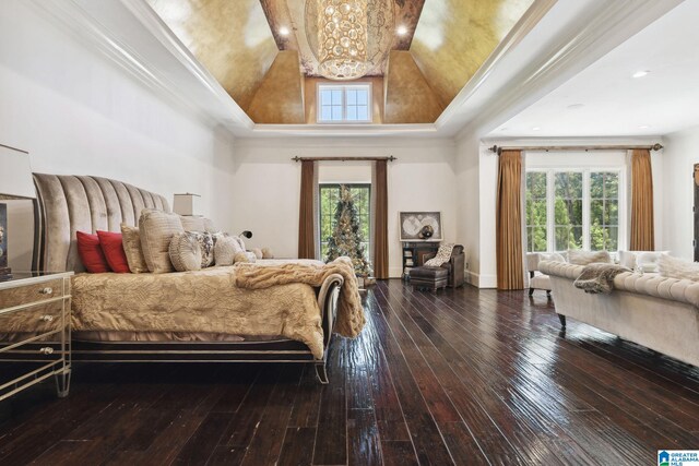 2821 Shook Hill Cir, Mountain Brook, AL 35223 - bedroom with a chandelier, multiple windows, wood-type flooring, and lofted ceiling