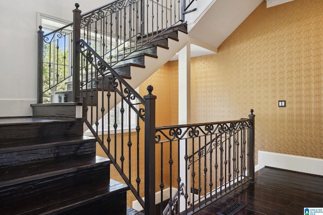 2821 Shook Hill Cir, Mountain Brook, AL 35223 - staircase with wallpapered walls, wood finished floors, and baseboards
