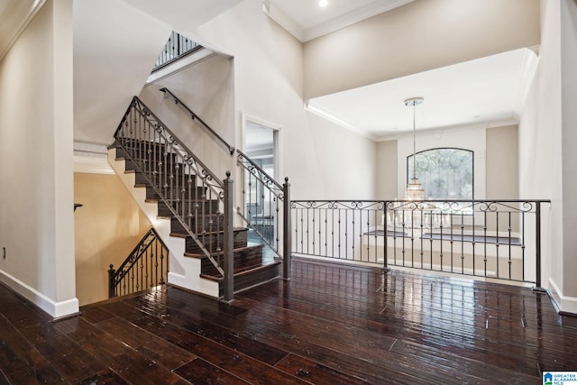 2821 Shook Hill Cir, Mountain Brook, AL 35223 - stairway featuring hardwood / wood-style floors, baseboards, ornamental molding, and a chandelier