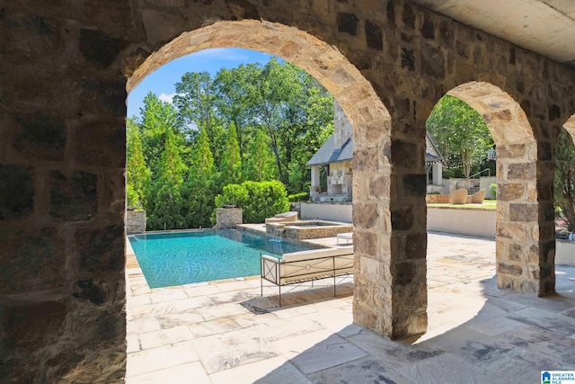 2821 Shook Hill Cir, Mountain Brook, AL 35223 - outdoor pool featuring an in-ground hot tub, a patio, and an outbuilding