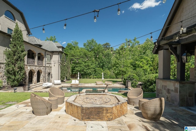 2821 Shook Hill Cir, Mountain Brook, AL 35223 - view of patio featuring a balcony, an outdoor fire pit, and an outdoor pool