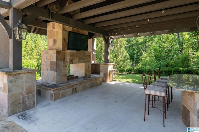 2821 Shook Hill Cir, Mountain Brook, AL 35223 - view of patio with an outdoor stone fireplace
