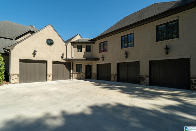 2821 Shook Hill Cir, Mountain Brook, AL 35223 - view of front of house featuring concrete driveway and stone siding