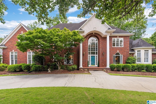 2100 Southwinds Cir, Hoover, AL 35244 - neoclassical home with brick siding and a front lawn
