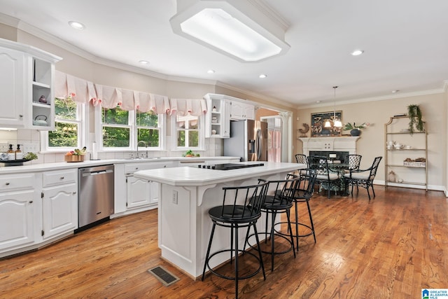 2100 Southwinds Cir, Hoover, AL 35244 - kitchen featuring stainless steel appliances, open shelves, a kitchen breakfast bar, white cabinetry, and recessed lighting