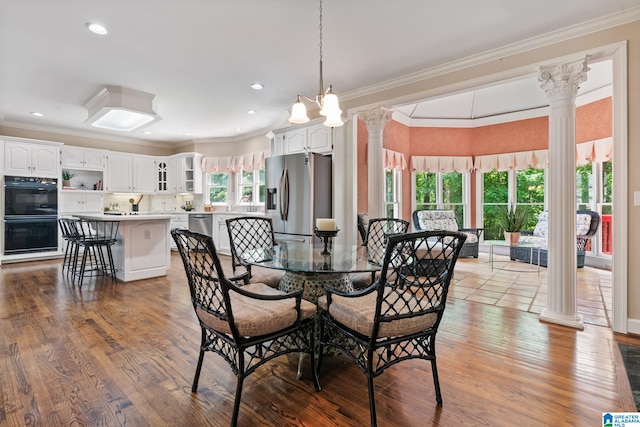 2100 Southwinds Cir, Hoover, AL 35244 - dining space featuring decorative columns, crown molding, wood finished floors, and recessed lighting