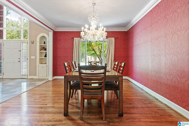 2100 Southwinds Cir, Hoover, AL 35244 - dining room with wallpapered walls, a chandelier, baseboards, wood finished floors, and ornamental molding