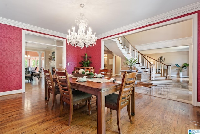 2100 Southwinds Cir, Hoover, AL 35244 - dining area featuring stairs, a chandelier, baseboards, ornamental molding, and wallpapered walls