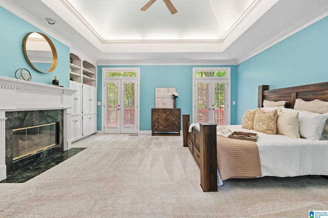 2100 Southwinds Cir, Hoover, AL 35244 - bedroom with french doors, access to exterior, light colored carpet, ornamental molding, and a high end fireplace