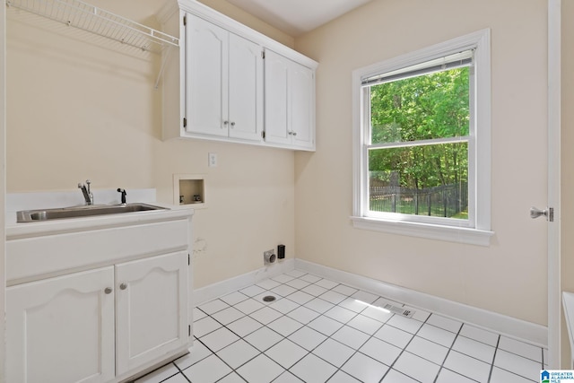 2100 Southwinds Cir, Hoover, AL 35244 - laundry room featuring washer hookup, cabinet space, baseboards, and light tile patterned floors