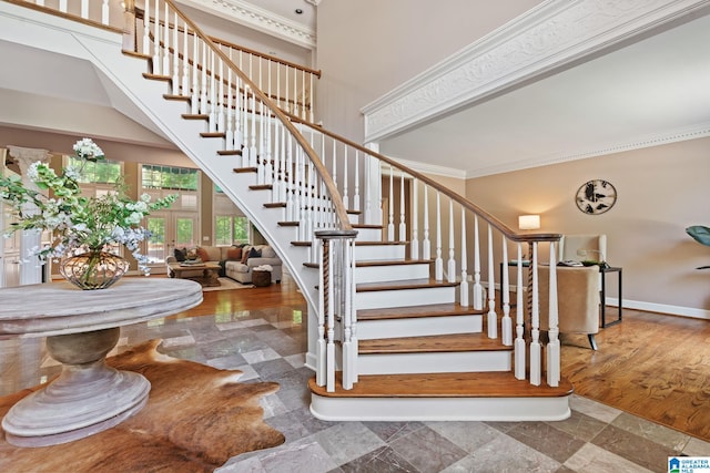 2100 Southwinds Cir, Hoover, AL 35244 - stairs with crown molding, a high ceiling, and baseboards