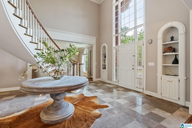 2100 Southwinds Cir, Hoover, AL 35244 - foyer featuring a towering ceiling, baseboards, stone finish flooring, and stairway