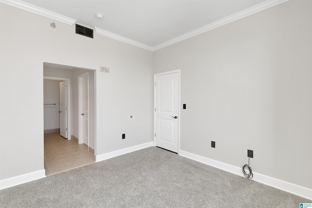 2024 2nd Ave N Unit 1703, Birmingham, AL 35203 - empty room with crown molding, light colored carpet, baseboards, and light tile patterned floors