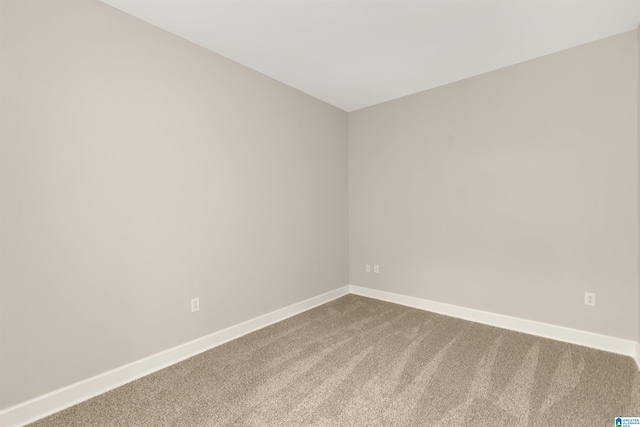 2024 2nd Ave N Unit 1703, Birmingham, AL 35203 - empty room with dark carpet and baseboards
