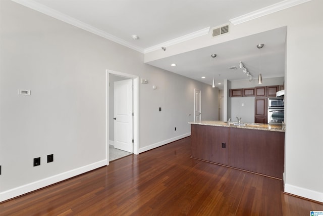 2024 2nd Ave N Unit 1703, Birmingham, AL 35203 - unfurnished living room with dark wood finished floors, baseboards, a sink, ornamental molding, and recessed lighting
