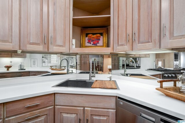 2600 Arlington Ave Unit 80, Birmingham, AL 35205 - kitchen featuring stainless steel dishwasher, a sink, light countertops, and light brown cabinetry
