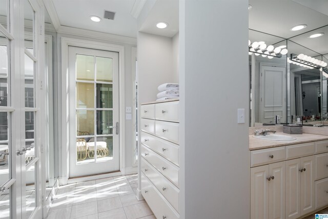 2600 Arlington Ave Unit 80, Birmingham, AL 35205 - bathroom featuring vanity, crown molding, tile patterned floors, and recessed lighting