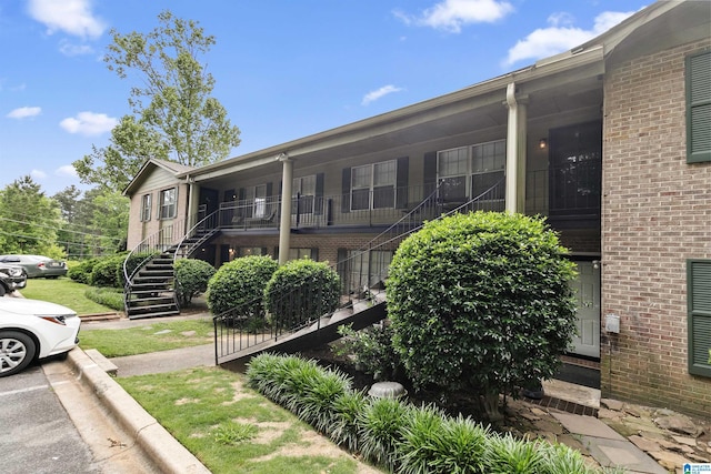 2837 Georgetown Dr Unit F, Hoover, AL 35216 - view of side of property with stairway and brick siding