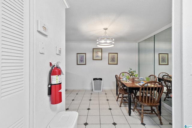 2837 Georgetown Dr Unit F, Hoover, AL 35216 - dining space featuring crown molding, light floors, a chandelier, and baseboards