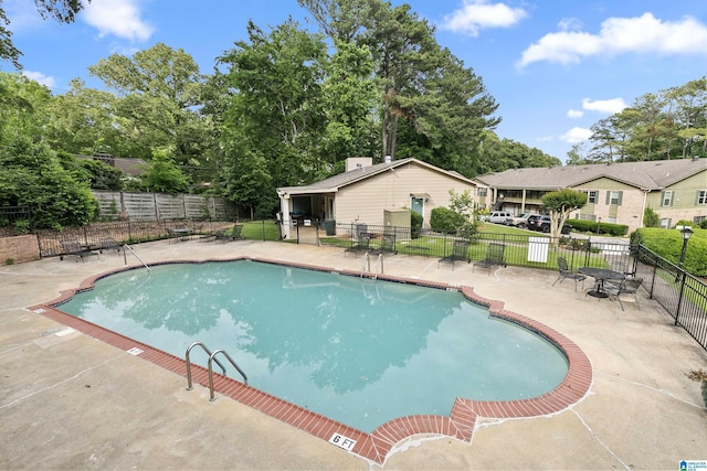 2837 Georgetown Dr Unit F, Hoover, AL 35216 - community pool featuring a patio area and view of scattered trees