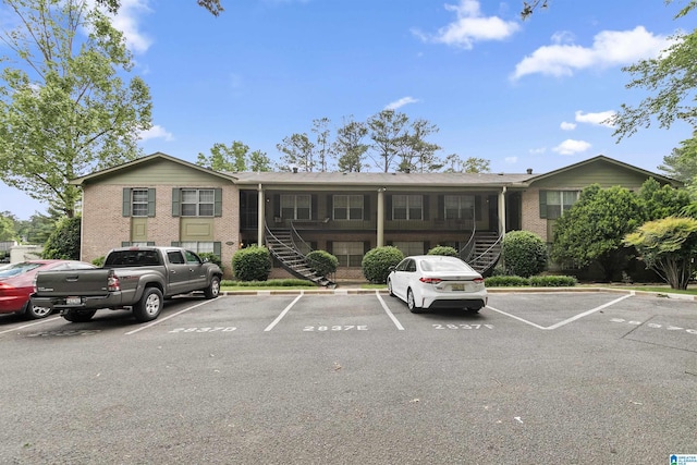 2837 Georgetown Dr Unit F, Hoover, AL 35216 - view of front of home with stairs, uncovered parking, and brick siding