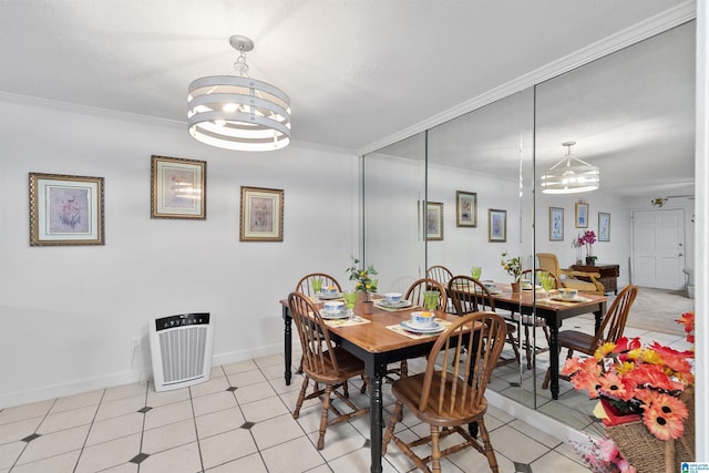 2837 Georgetown Dr Unit F, Hoover, AL 35216 - dining area featuring a chandelier, crown molding, and baseboards