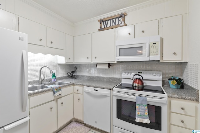2837 Georgetown Dr Unit F, Hoover, AL 35216 - kitchen with white appliances, a sink, crown molding, tasteful backsplash, and white cabinetry