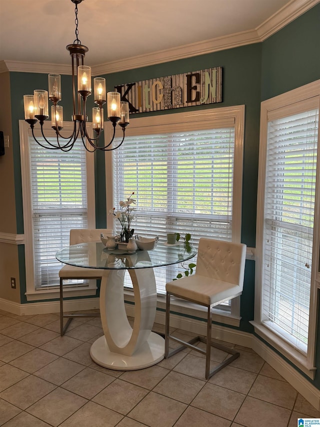5616 Elliott Cir, Mccalla, AL 35111 - dining space featuring light tile patterned floors, a chandelier, crown molding, and baseboards