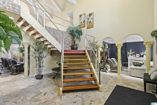 200 Asphodel Dr, Dothan, AL 36303 - stairway featuring ornate columns, a towering ceiling, and arched walkways